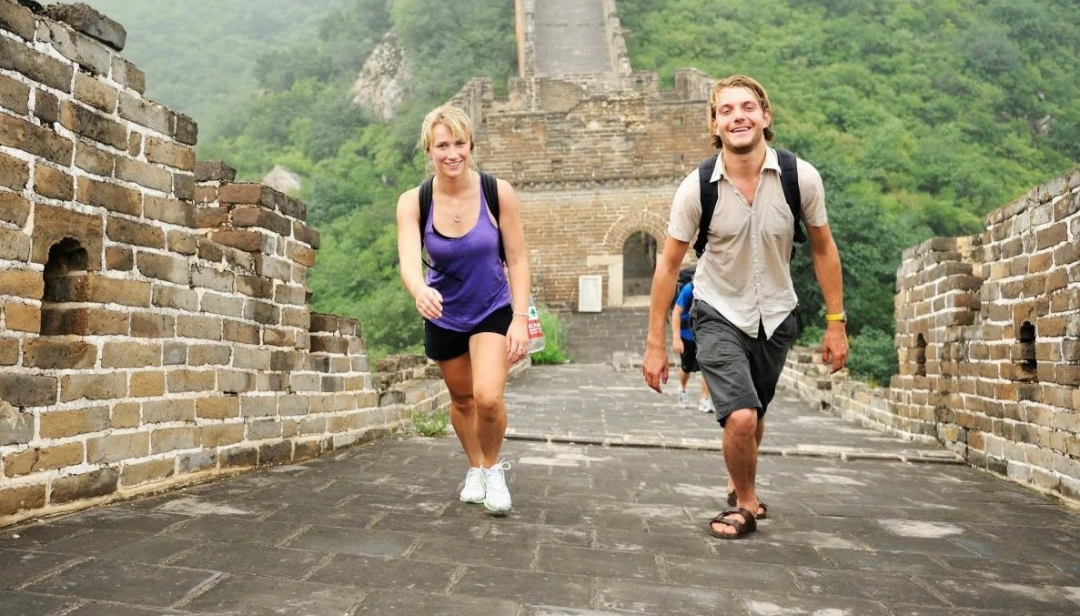 Happy travelers taking selfie at Great Wall of China