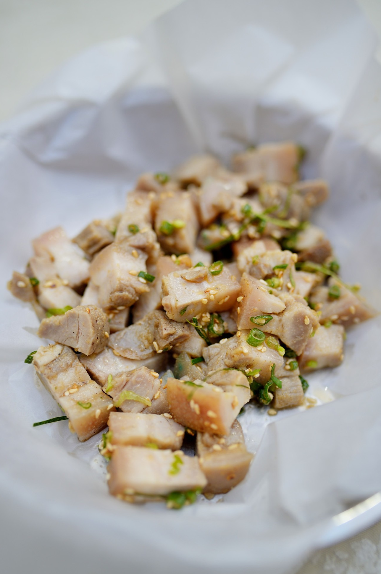  A close-up of the glistening Jun'an Steamed Pork, ready to be served