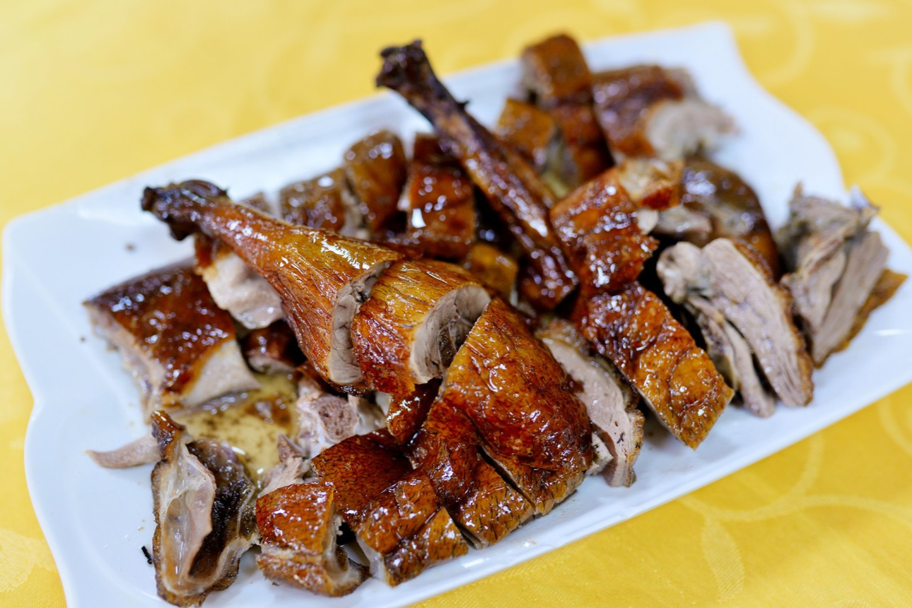  A glistening serving of Shao'e Zai's roast goose, cut into pieces
