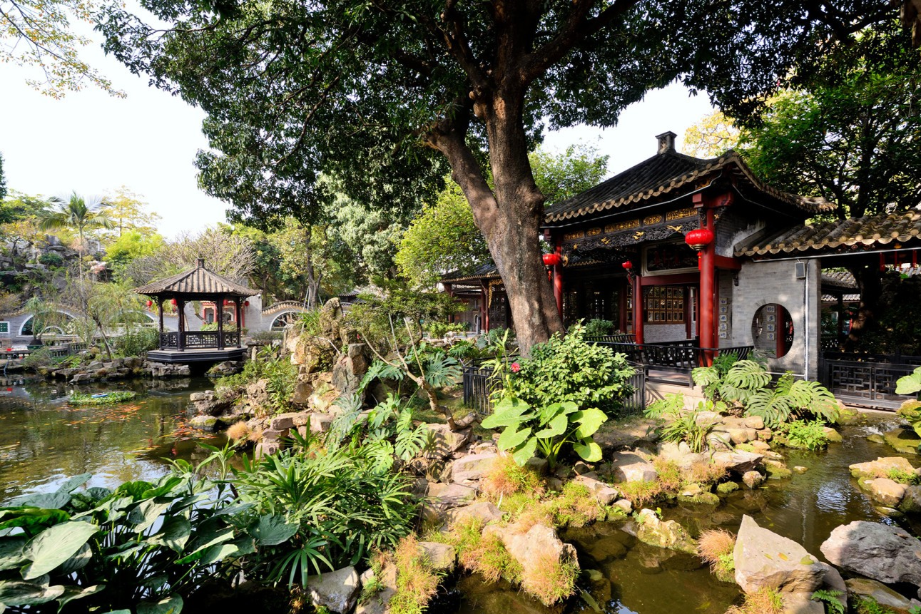  A quintessential view of Qinghui Garden, perhaps featuring a pond, pavilion, and lush greenery