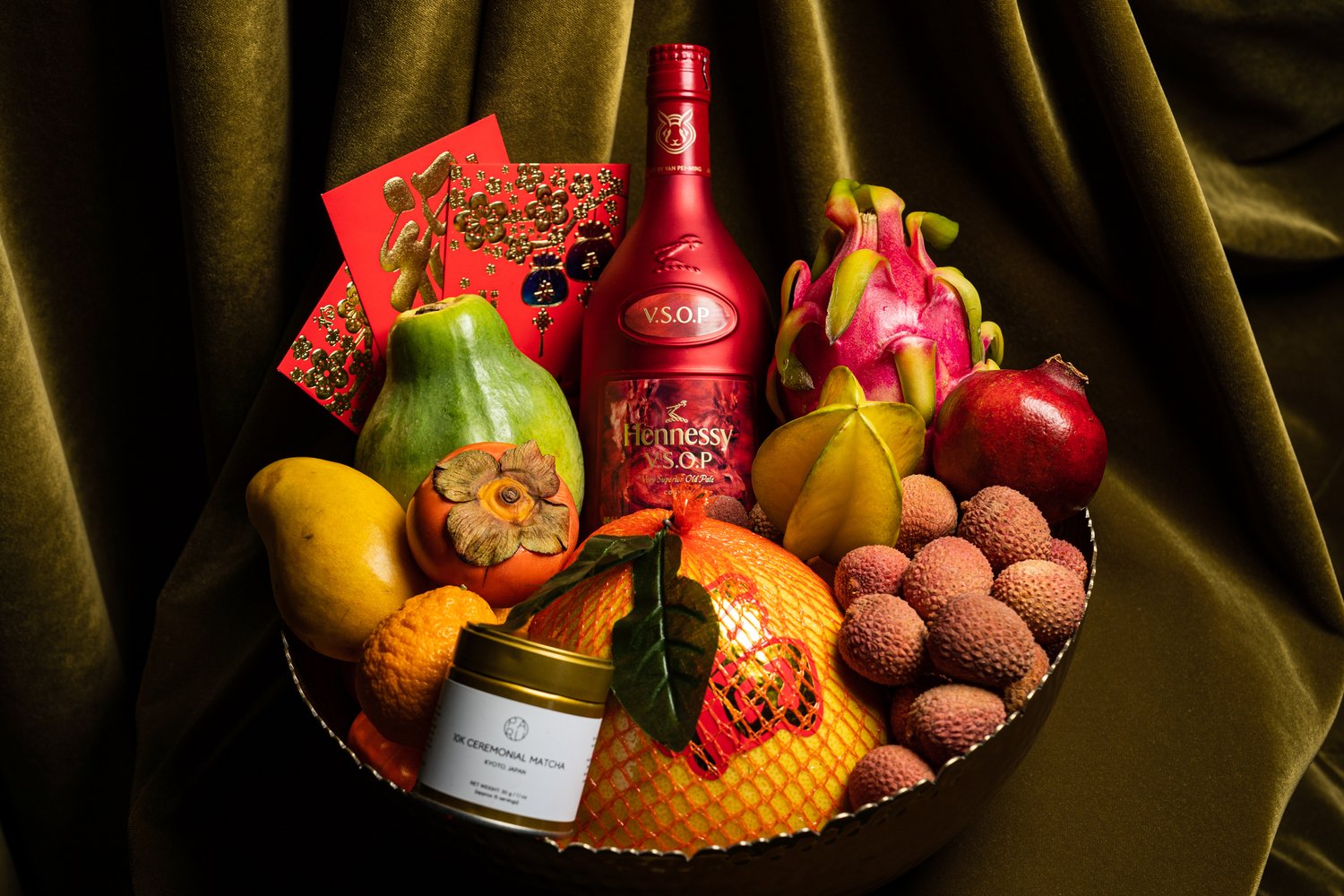 Appropriate Chinese gift items like tea, fruit basket, or red envelopes