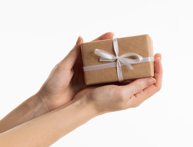 Beautifully wrapped gift being presented with both hands