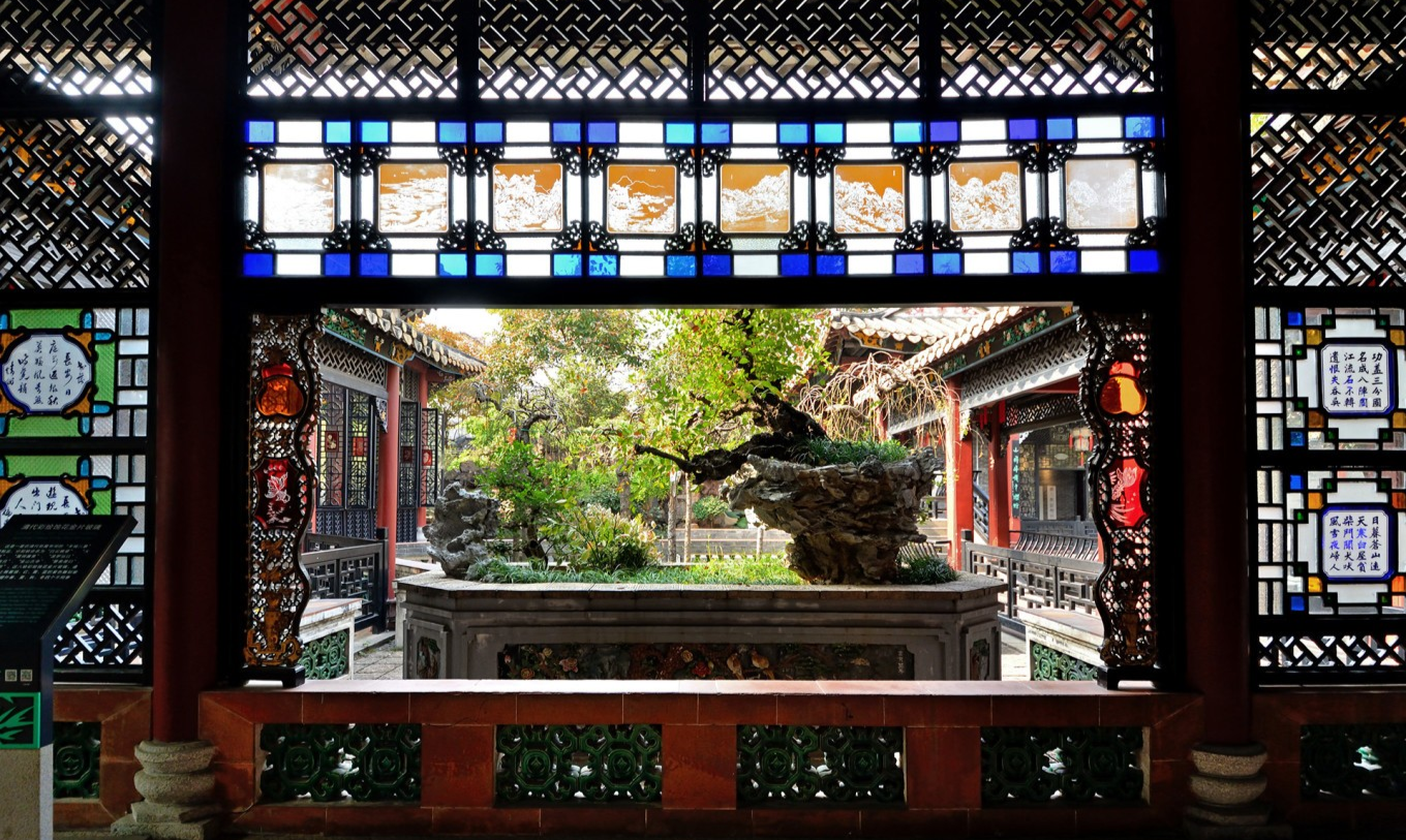  Close-up of a detailed glass etching or wood carving from Qinghui Garden