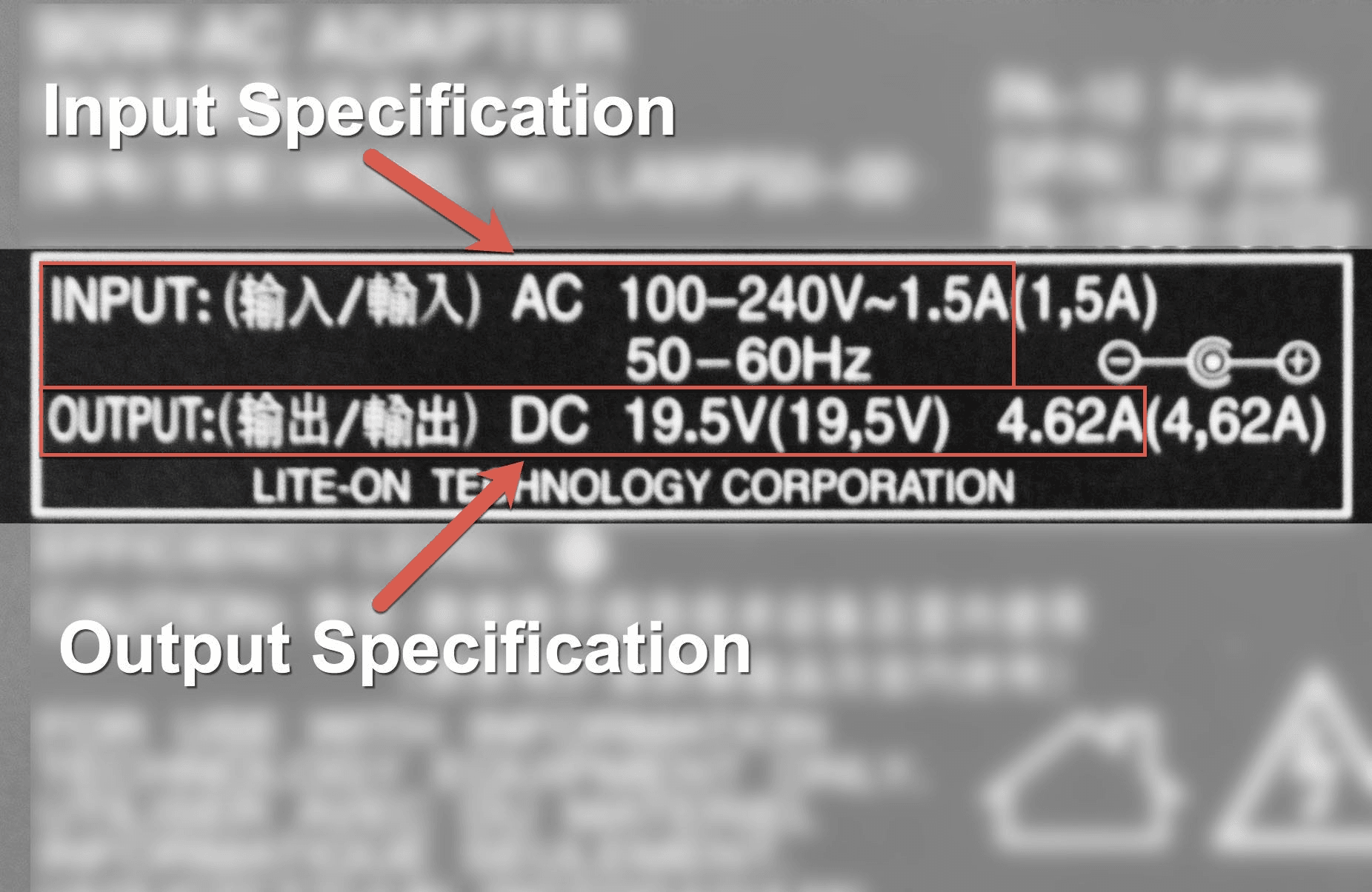 Close-up of power adapter label showing voltage input specifications