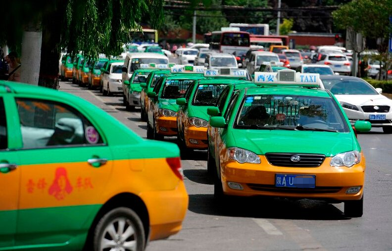 Line of official taxis waiting at a taxi stand in a Chinese city