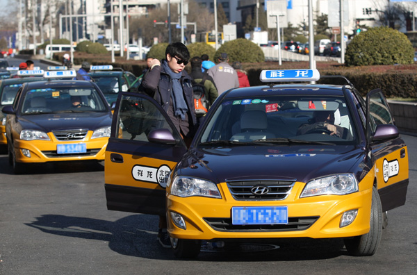 Official Chinese taxi with meter visible