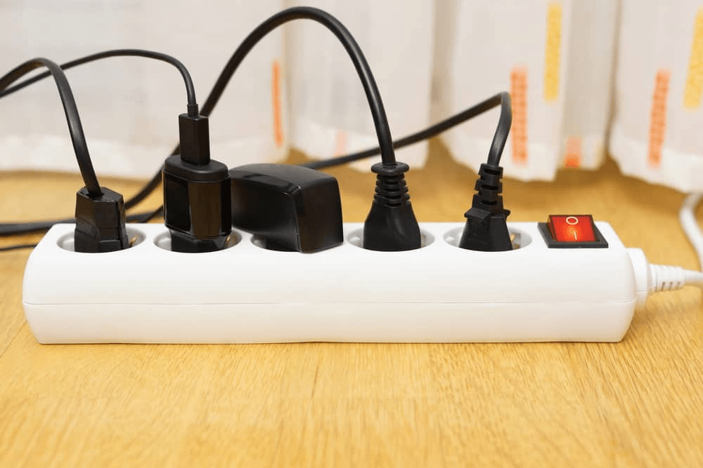Power strip with multiple devices plugged in
