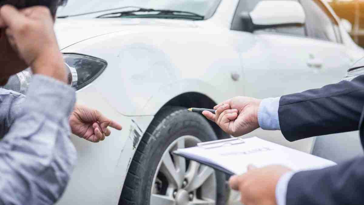 Rental car being inspected by customer and agent before handover