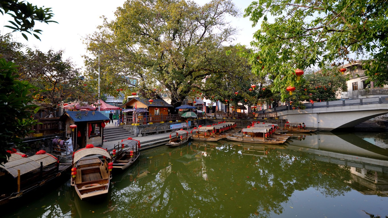  Serene canal scene in Fengjian Water Town with traditional boats