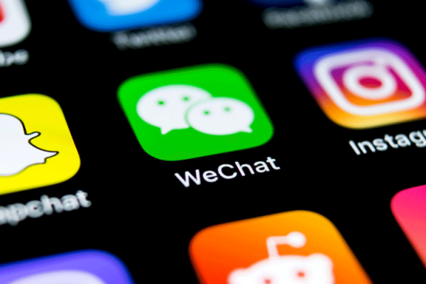 Smartphone showing WeChat interface with multiple functions