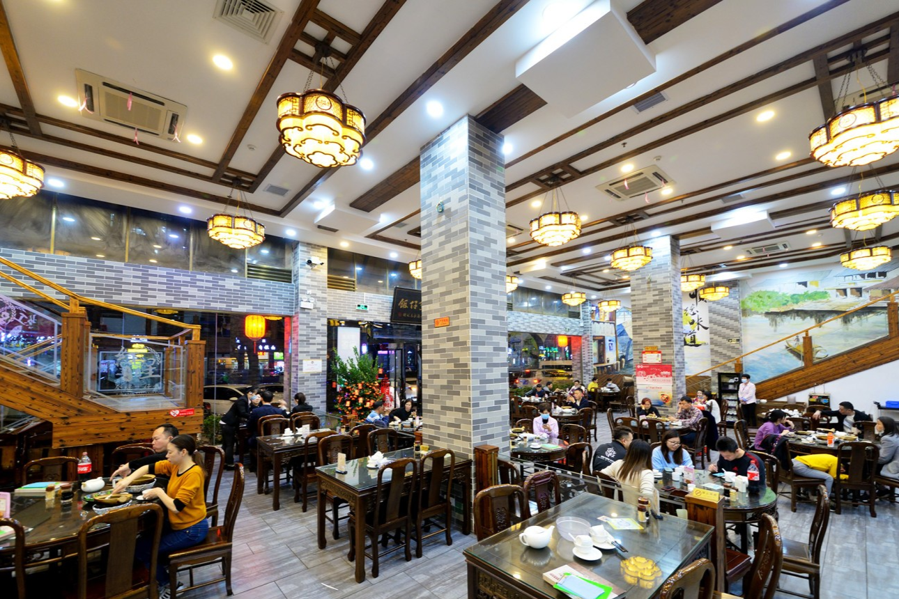  The bustling kitchen or clay pots being cooked at Hongxing Guangfa