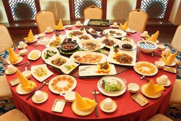 Traditional Chinese banquet table setting with multiple dishes