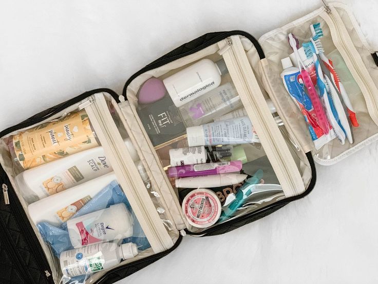 Travel-sized toiletries organized in a hanging toiletry bag