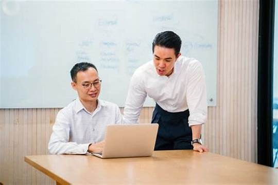 Two business people having a subtle conversation