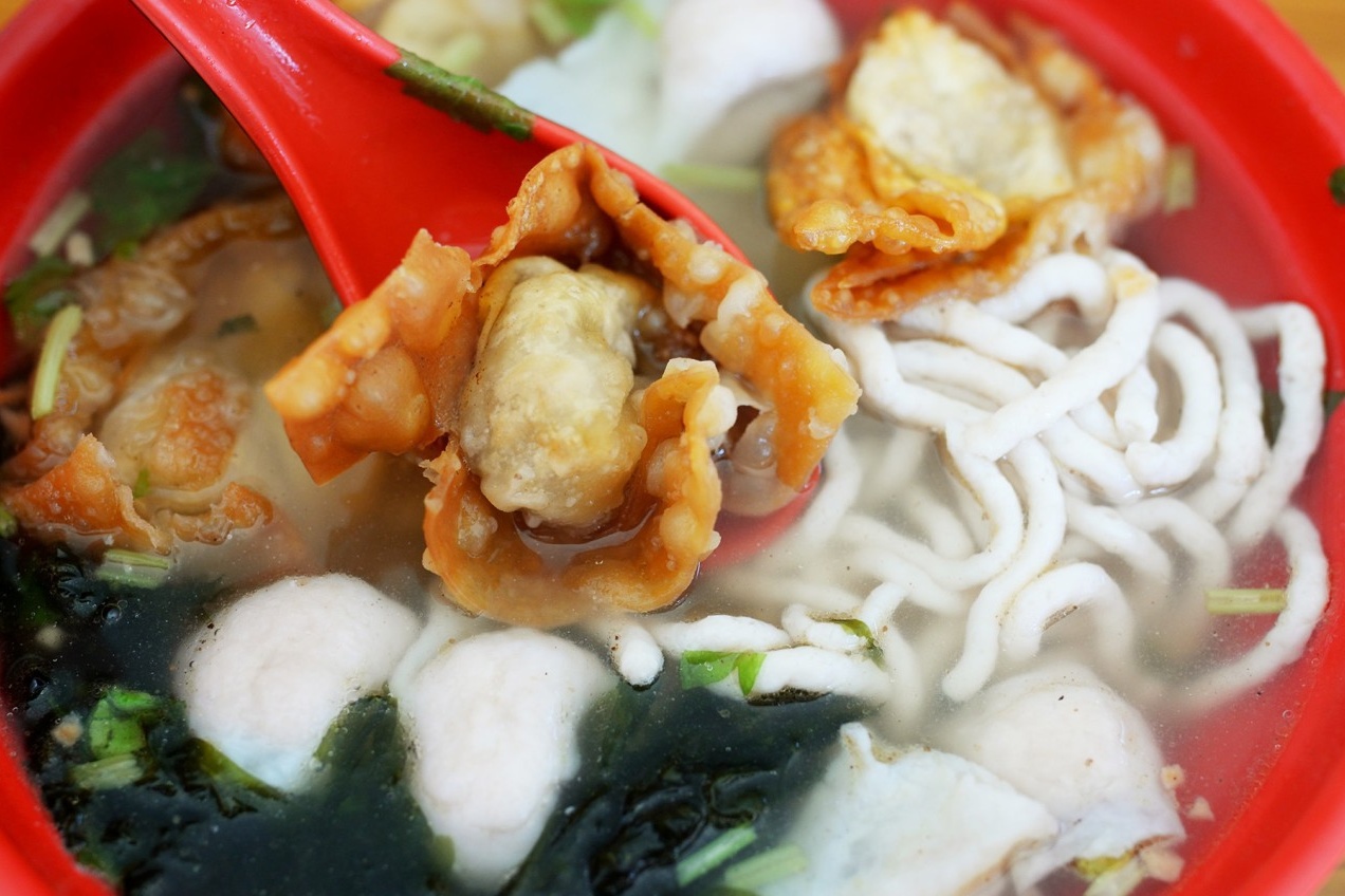  A beautifully composed shot of a clear soup bowl