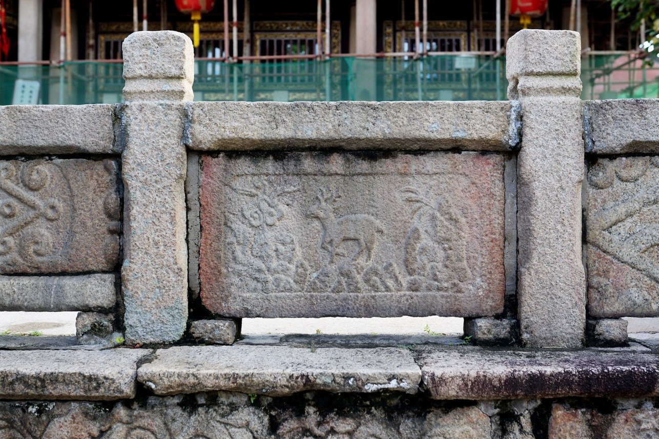  A detailed shot focusing on one of the ancient Tang Dynasty stone sutra pillars