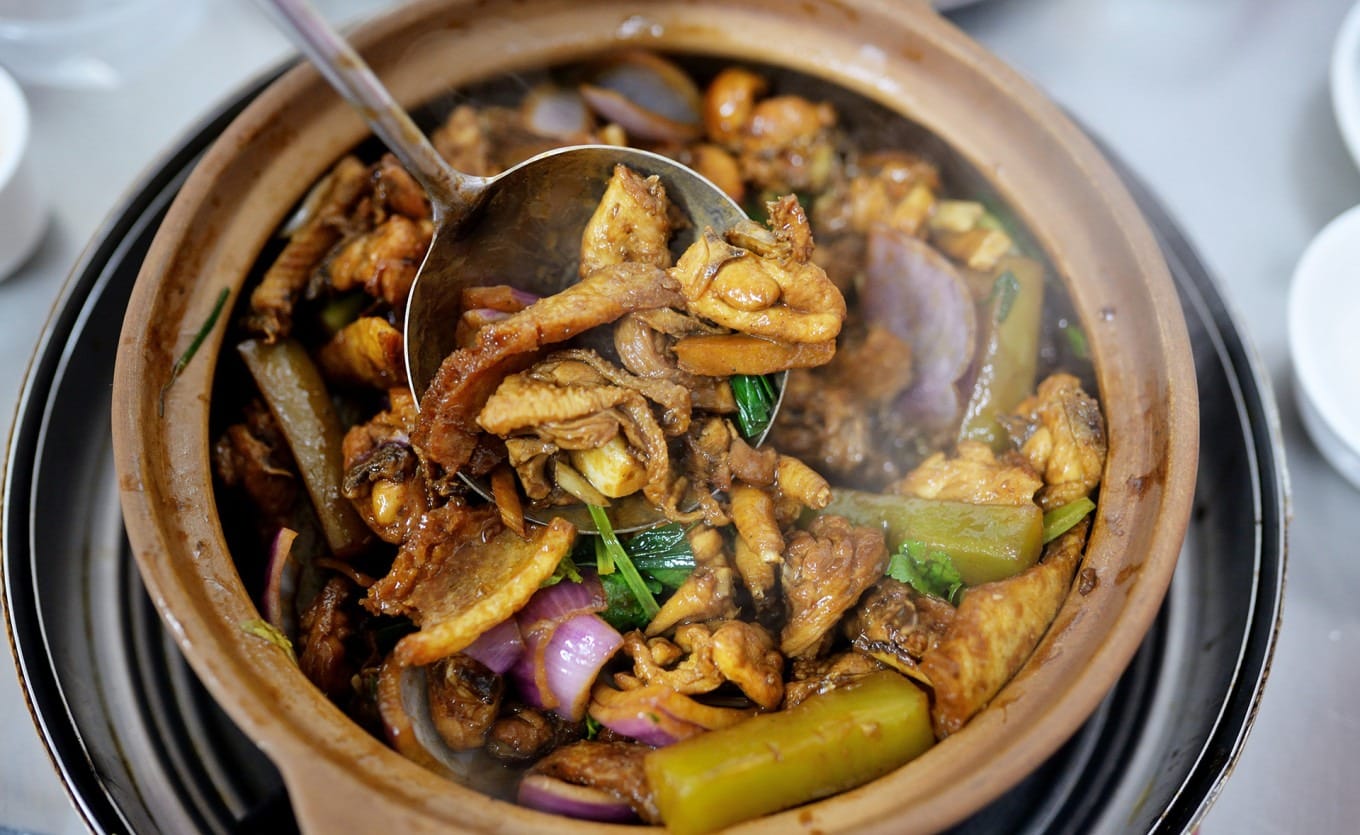 Close-up of Hu Xu Lao chicken pot with glossy sauce and springy texture