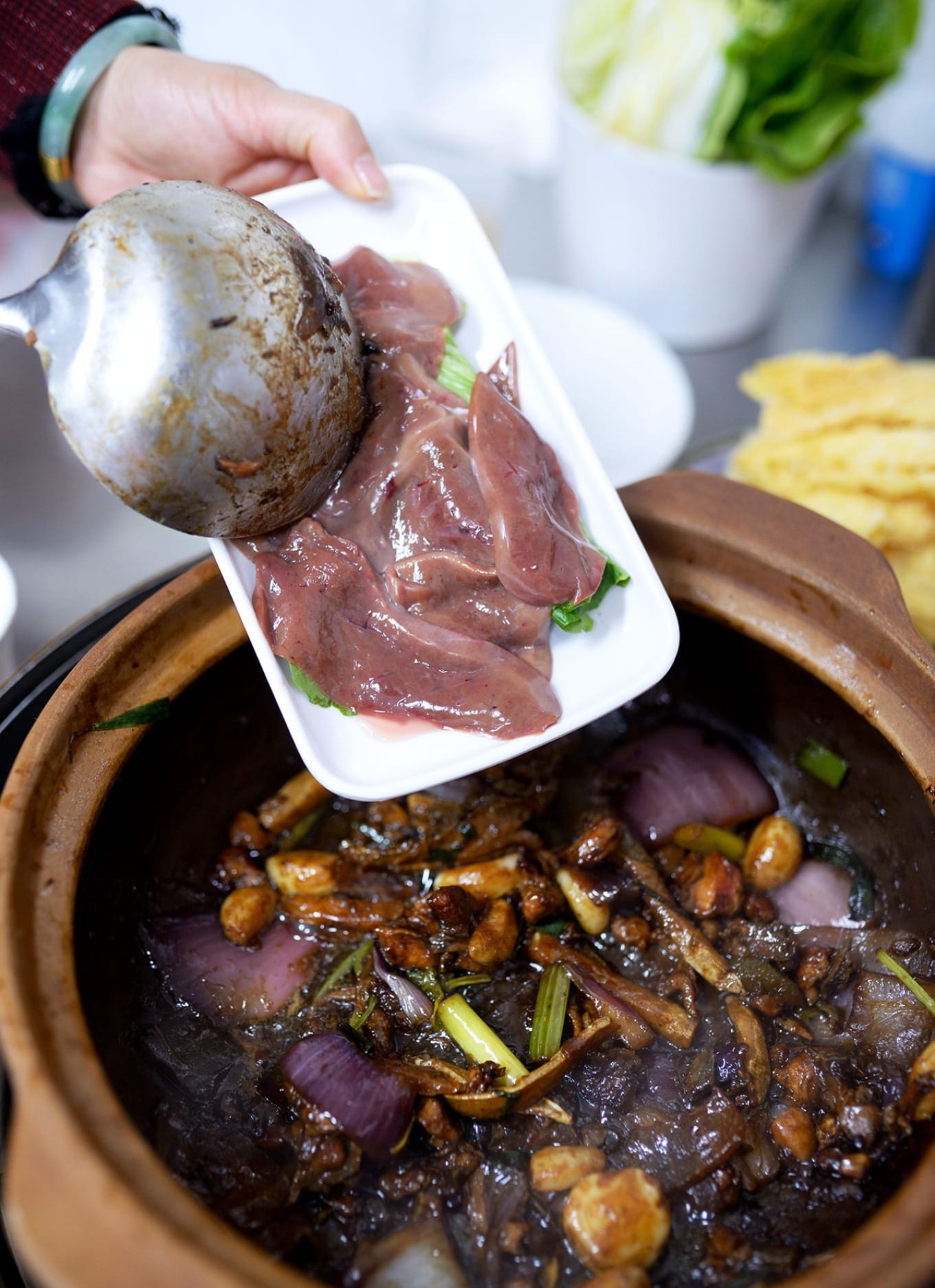 Add-on ingredients including stir-fried pork skin and fresh goose liver