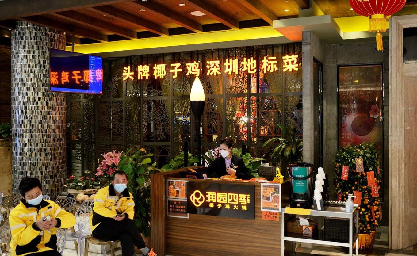 Interior of Runyuan Four Seasons Coconut Chicken Hotpot with tropical-style decor