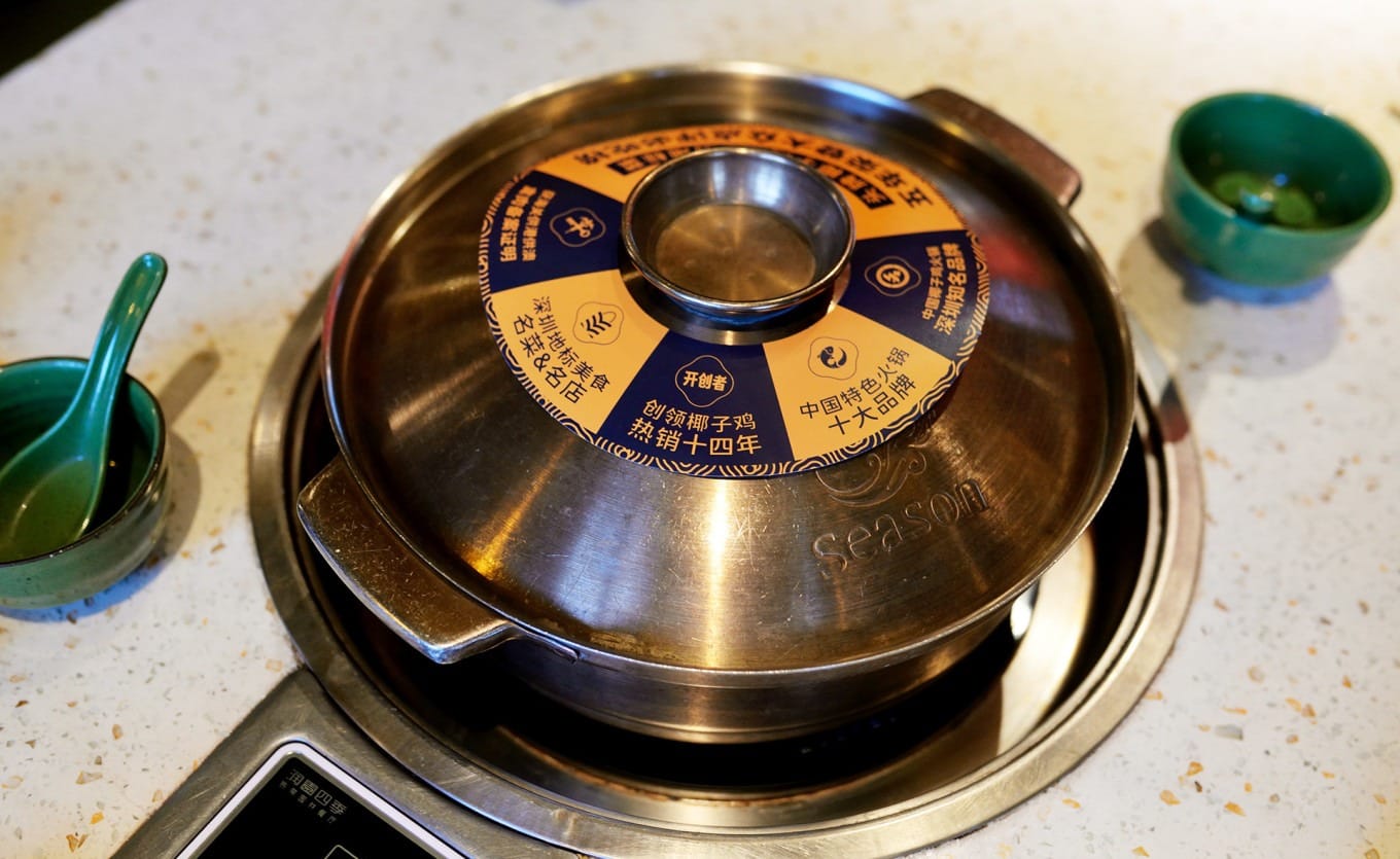 Fresh coconut water and Qingyuan chicken prepared for coconut chicken hotpot