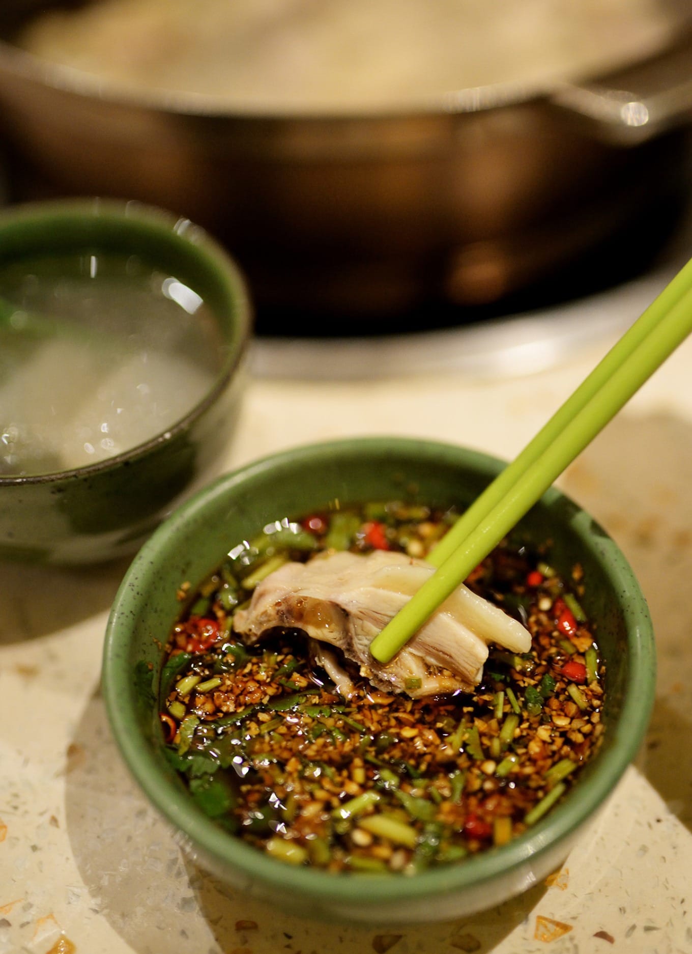 Tender coconut chicken dipped in ginger and chili sauce