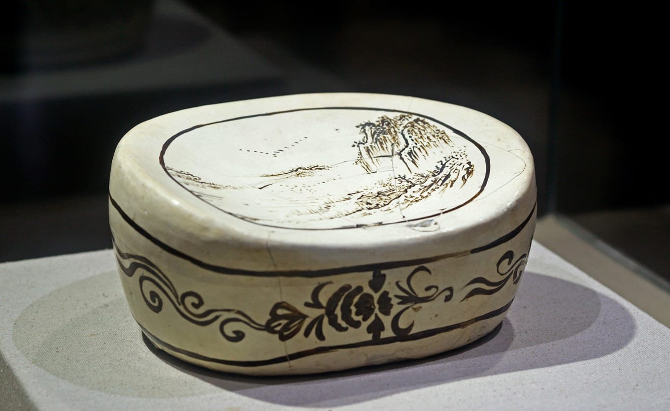 Jin Dynasty ceramic pillow painted with landscape scene from Changzhi Kiln
