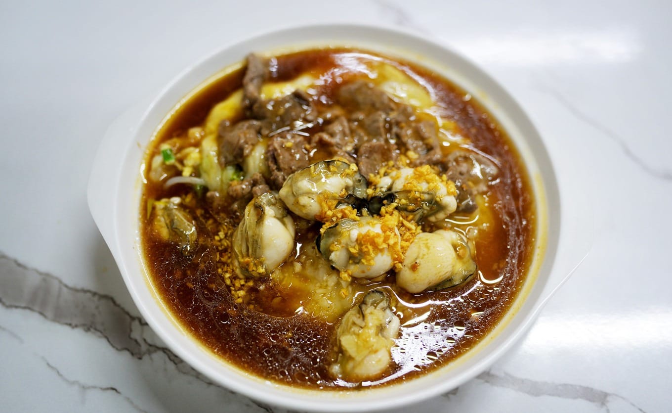 Oyster and beef rice noodle rolls topped with braising sauce and garlic oil