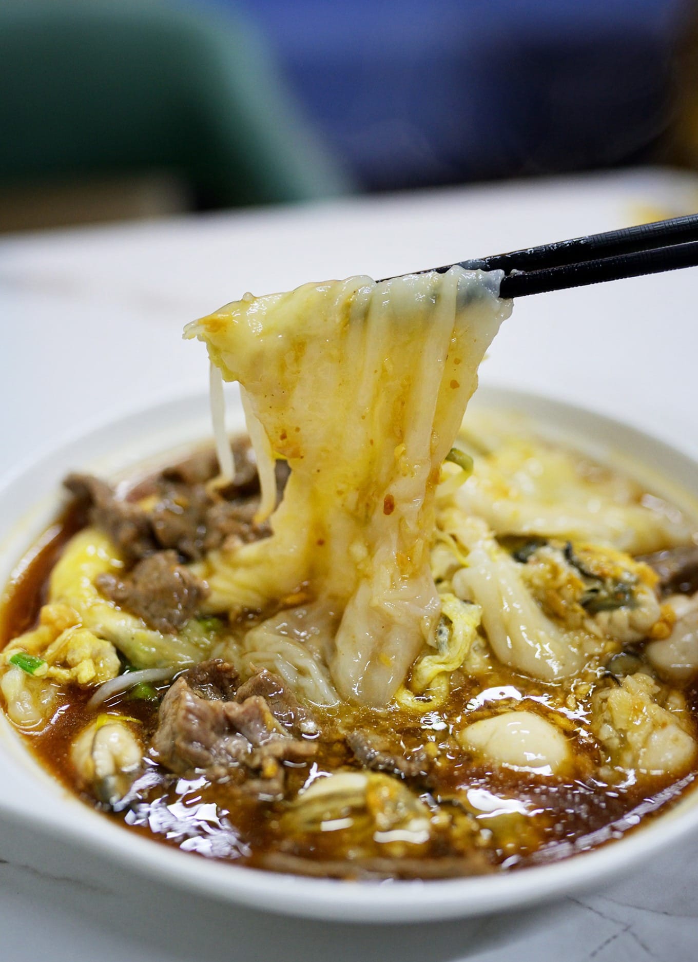 Thin, glossy rice noodle rolls with plump oysters and beef