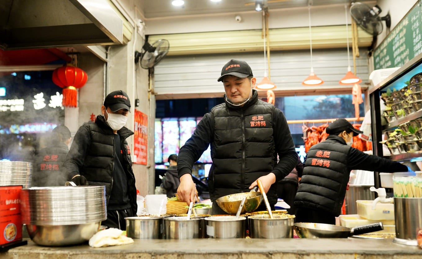Sichuan-style mao cai red oil broth bubbling with spices