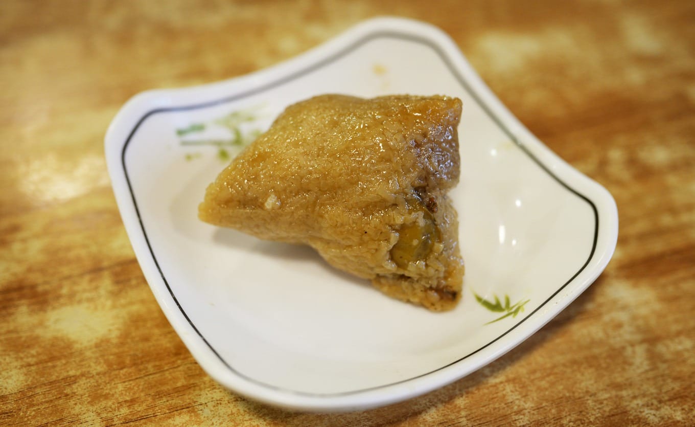 Chaoshan-style zongzi with pork belly, salted egg yolk, and chestnuts