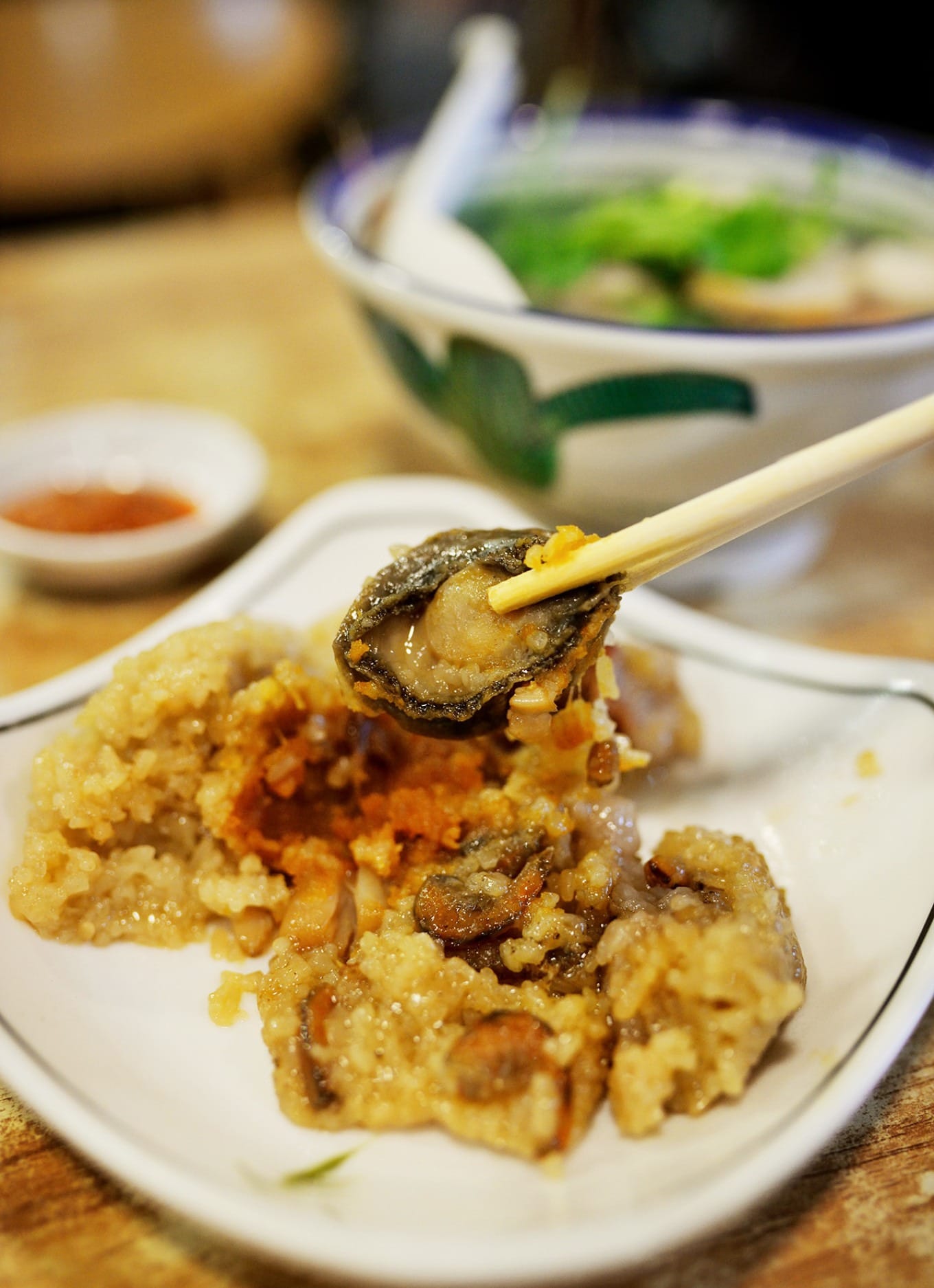 Luxury abalone zongzi filled with pork belly, egg yolk, chestnuts, and dried seafood