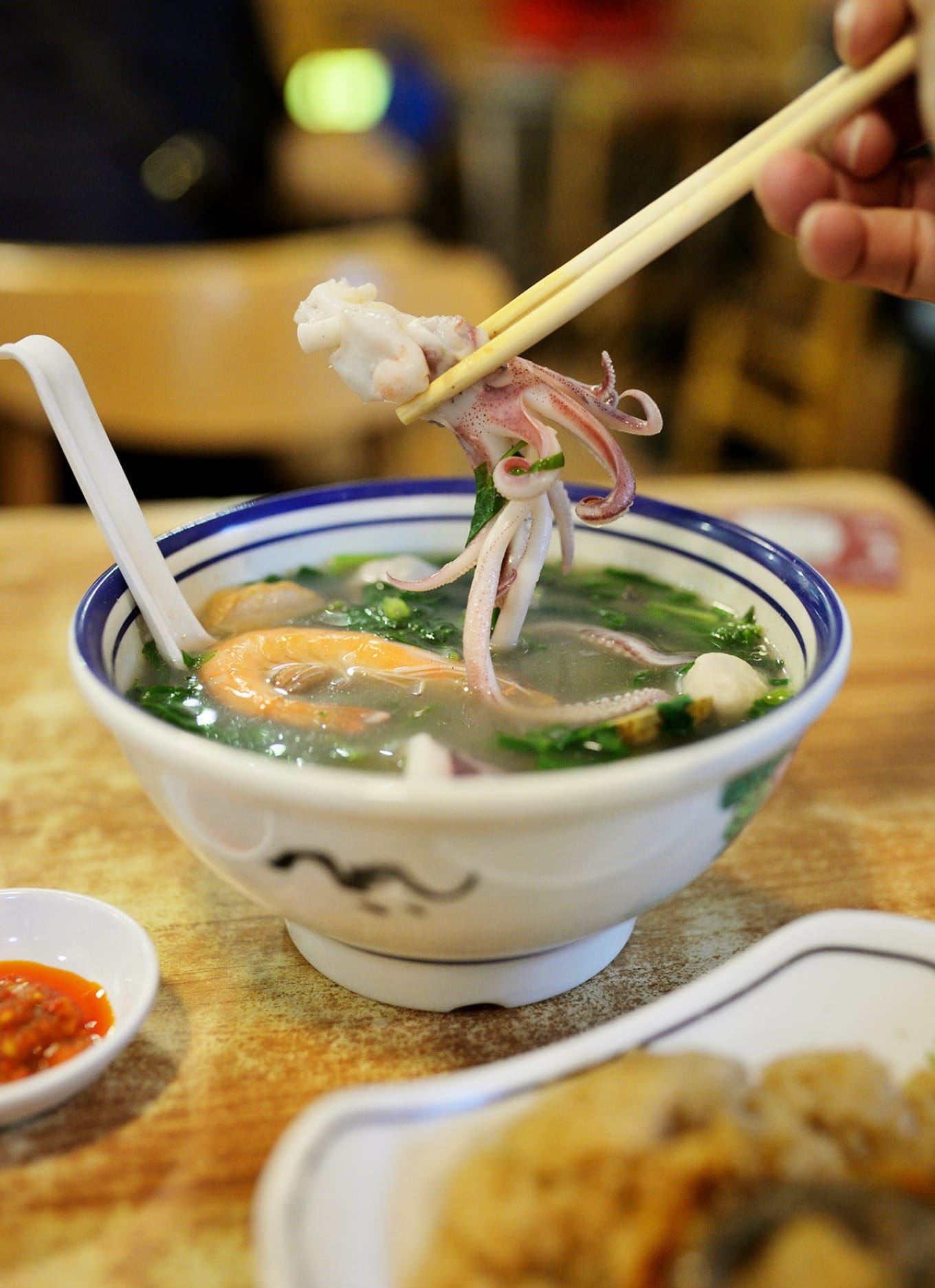Clear, lightly seasoned Cantonese-style seafood soup highlighting natural flavors
