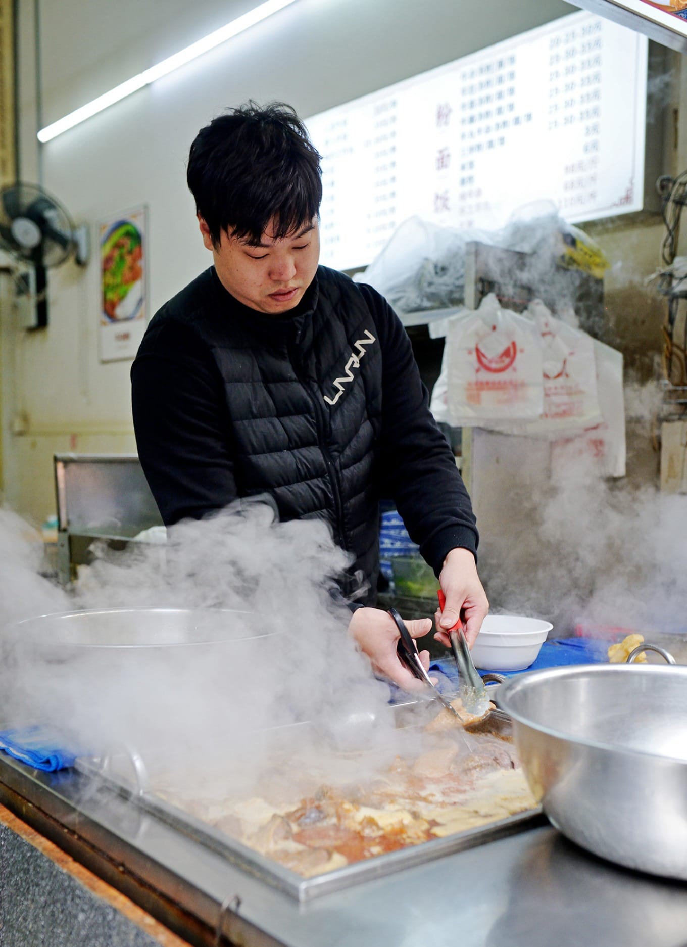 Braised beef offal simmering in seasoned hewei-style sauce
