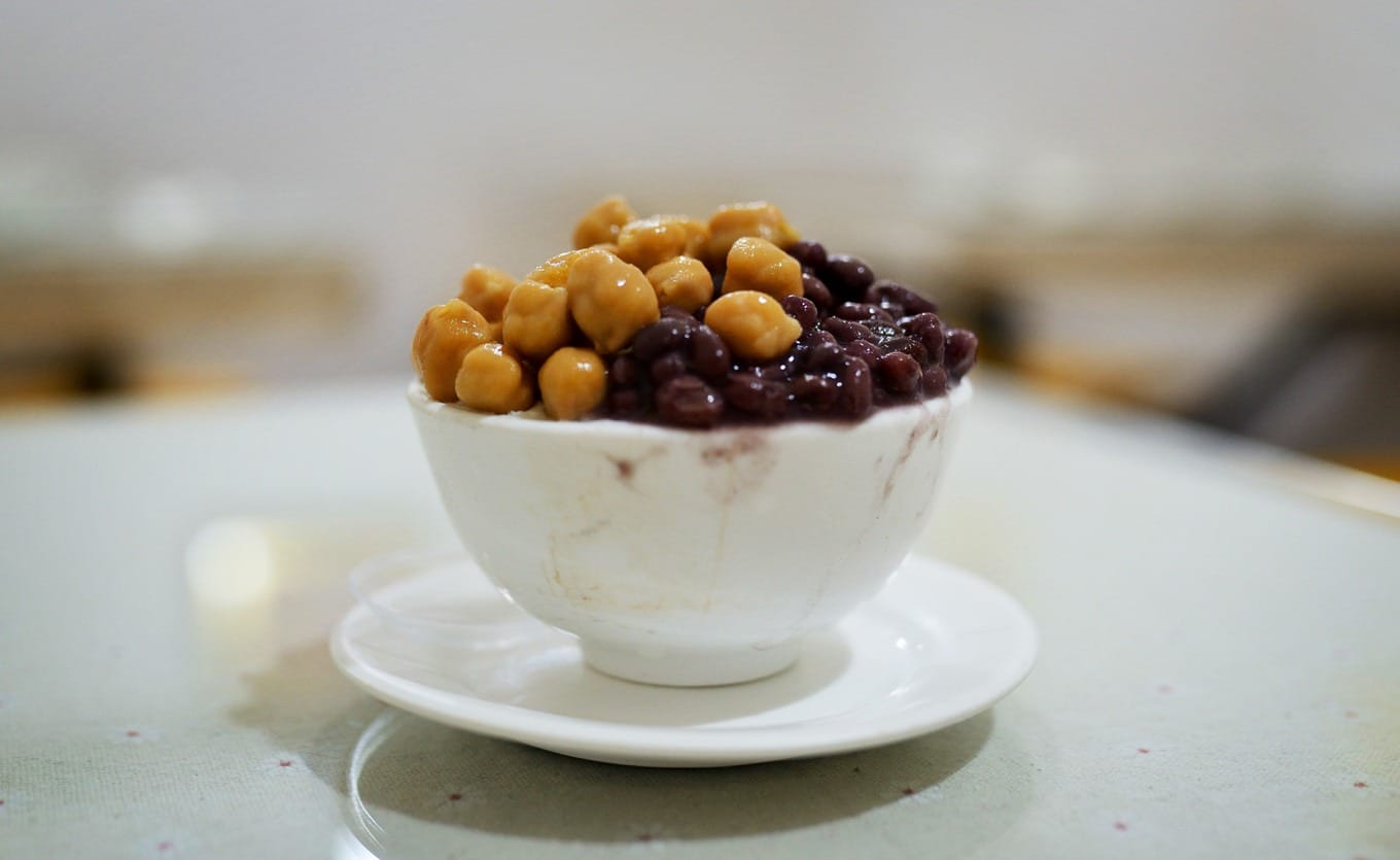 Double-skin milk pudding topped with red beans and chickpeas