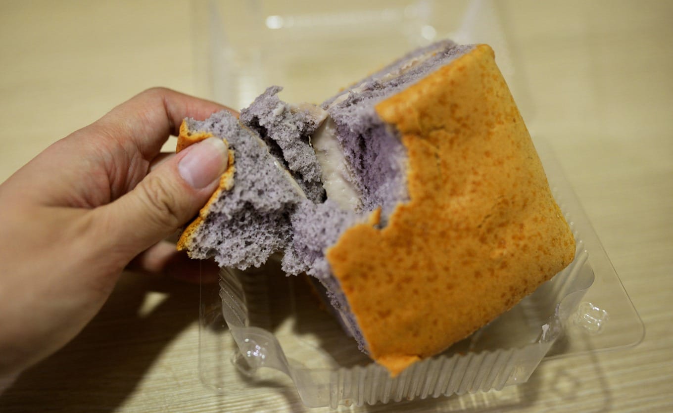 Close-up of fluffy taro cake with visible taro chunks inside