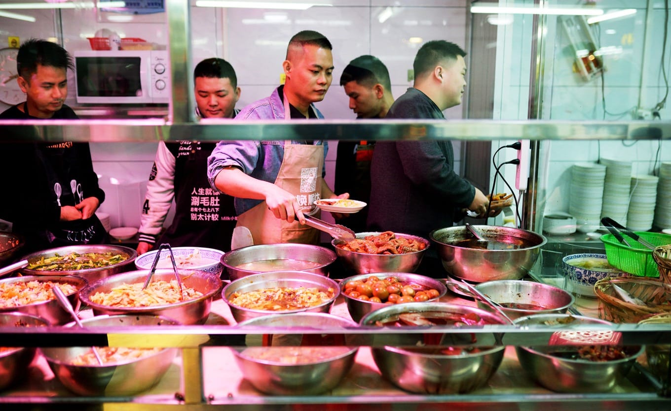Chaoshan-style Da Leng counter with assorted cold dishes and congee