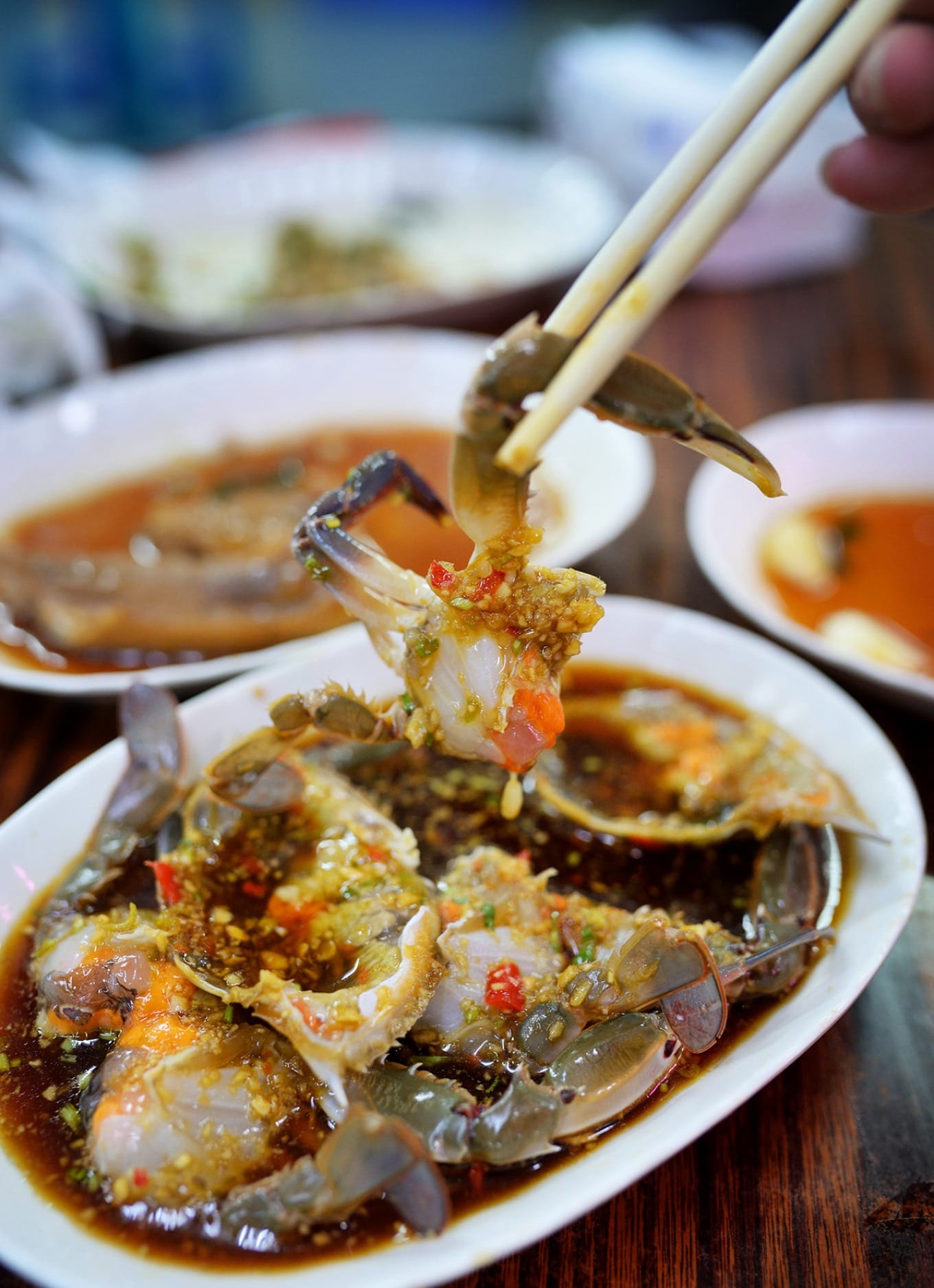 Chaoshan-style raw marinated crab with orange roe and glossy meat