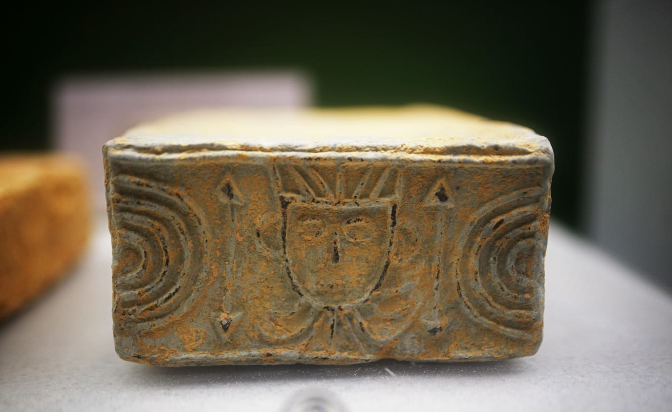 Han Dynasty tomb brick with human-face pattern from Shenzhen