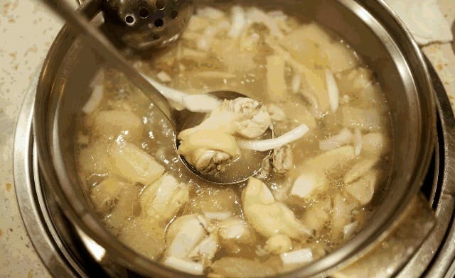 Shenzhen urban village street filled with small local restaurants and food stalls