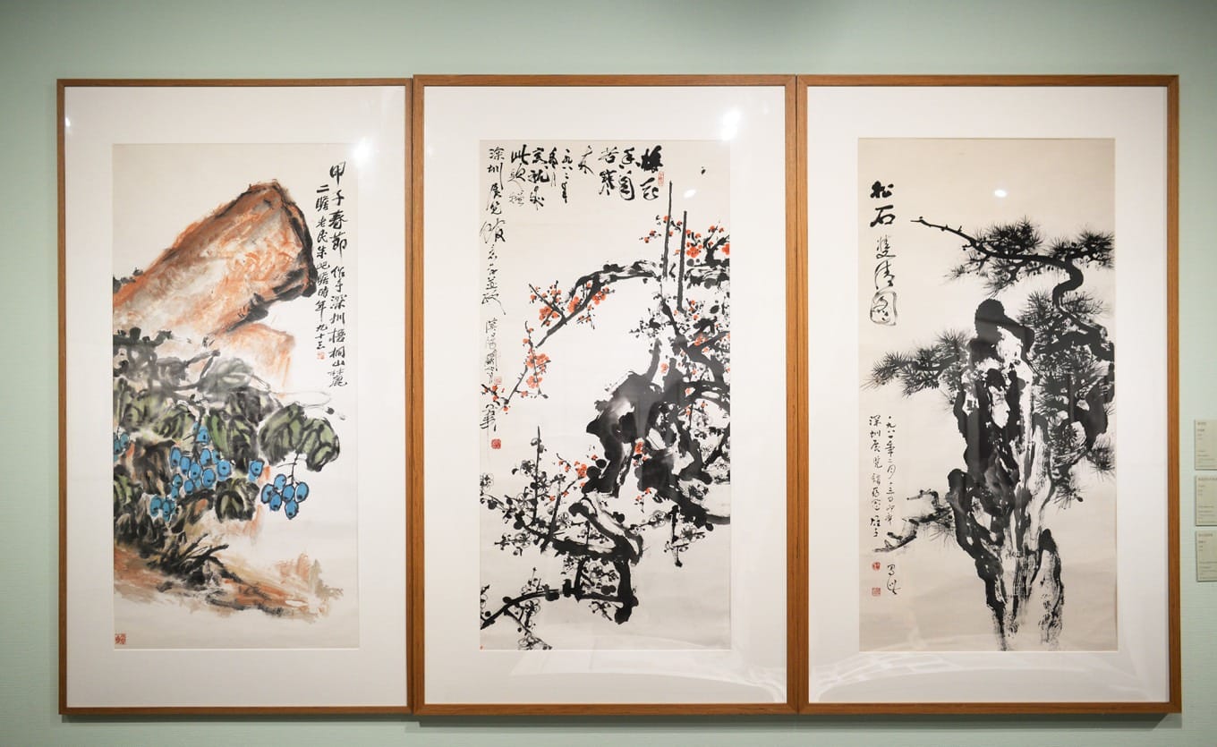 Ink paintings by Zhu Qizhan, Guan Shanyue, and Li Xiongcai displayed together