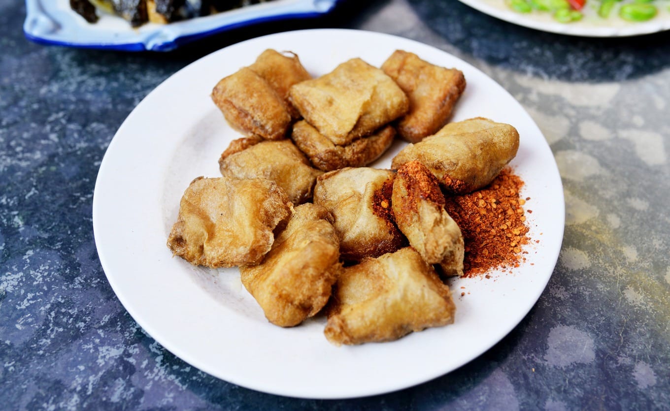 Stir-fried fresh green hebao beans in a light sauce