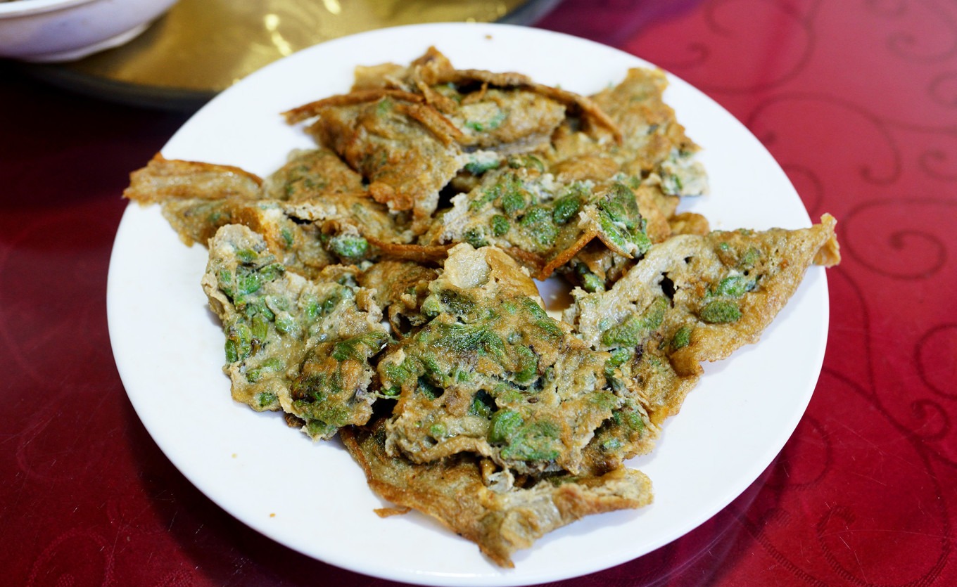 Exterior storefront of Wuwei Restaurant with signage