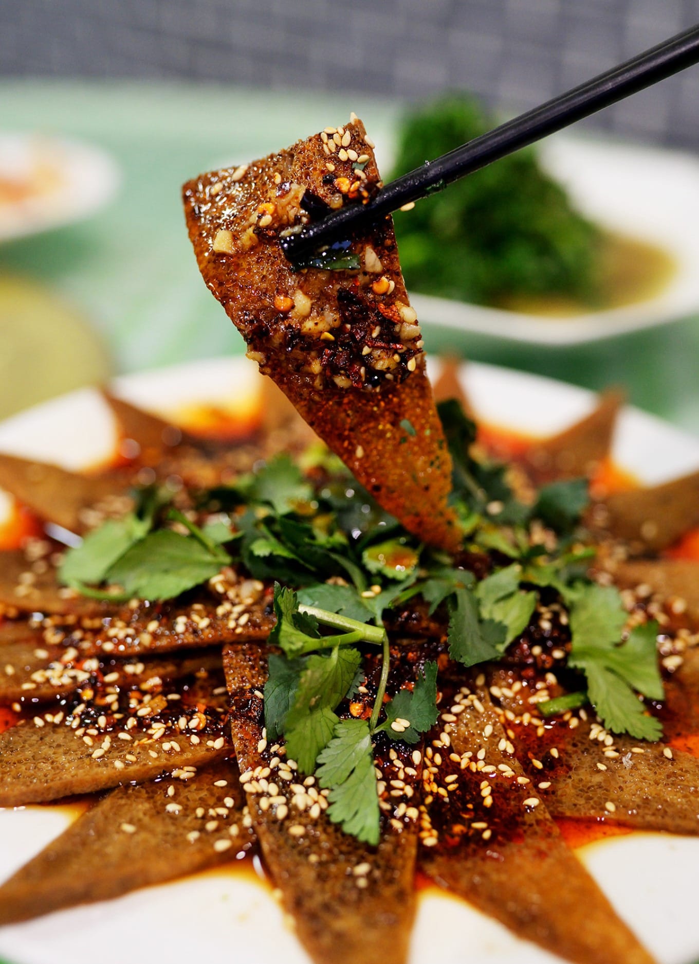 A plate of Yan Cai Chao Rou, a stir-fry of preserved vegetables and pork
