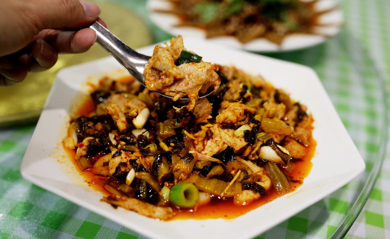 A plate of stir-fried Ci Wu Jia, a local wild vegetable
