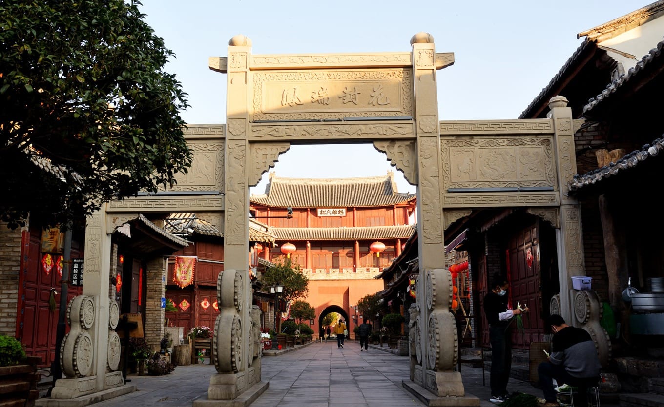 A view down the historic North Street in Weishan Ancient Town, lined with traditional shopfronts