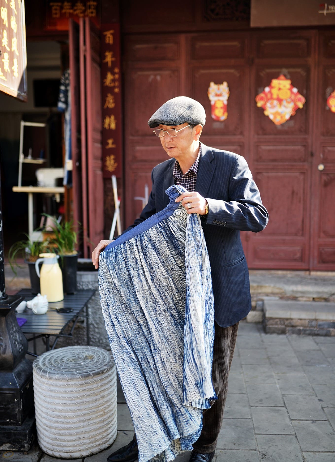 A local resident going about their day on the historic cobblestone street