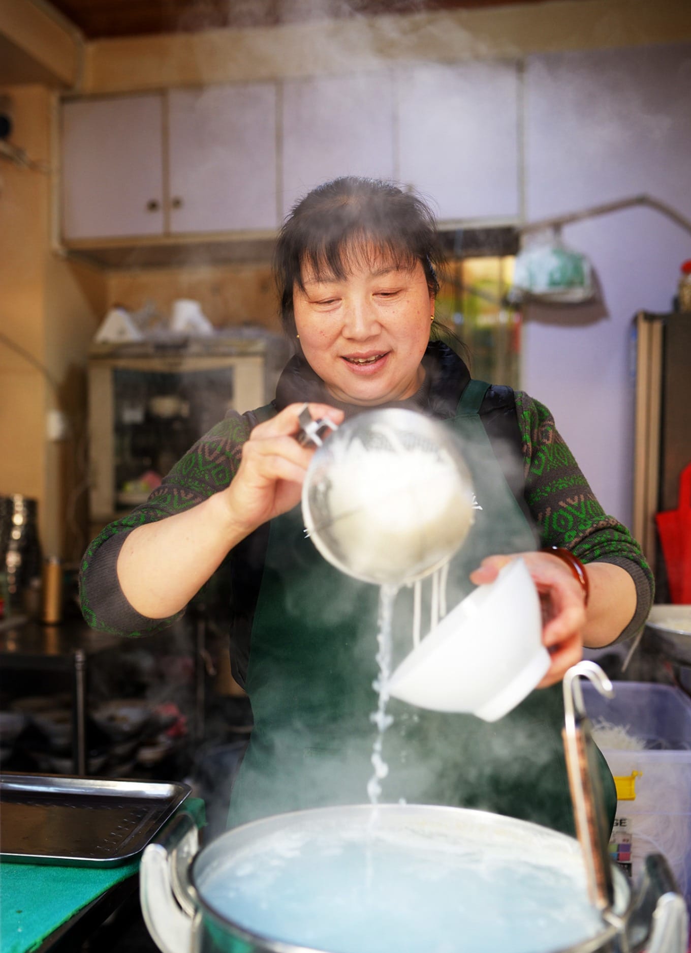 Close-up of Crossing-the-River Rice Noodles with braised meat and side dishes