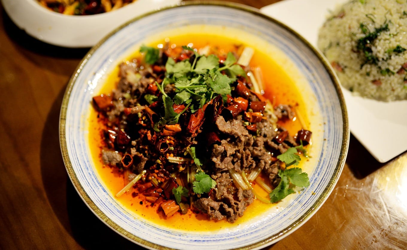 Close-up of Fragrant Stir-fried Beef dish with beef, chilies, and celery