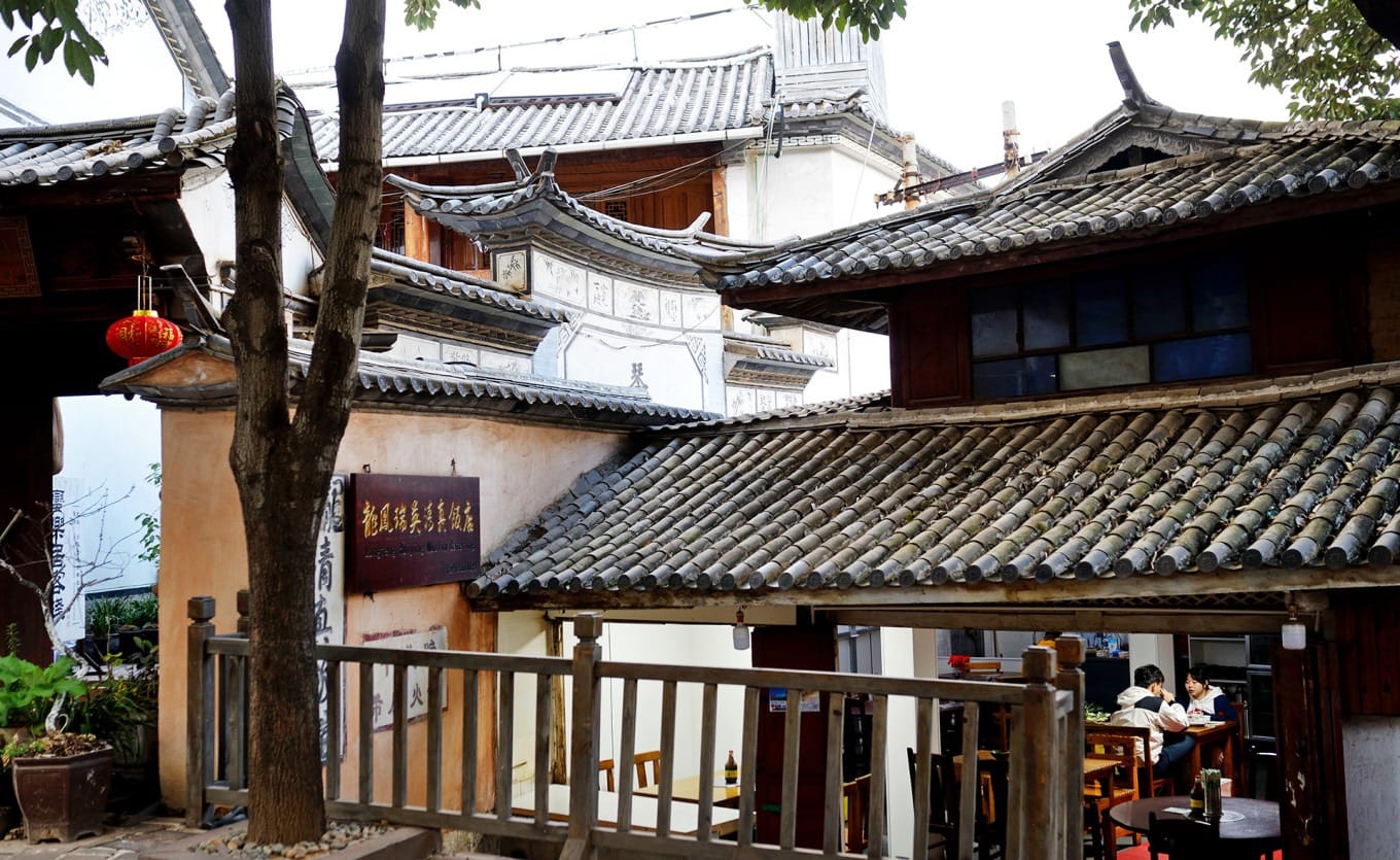 A rustic iron pot beef hotpot simmering at Longfeng Ruiying Halal Restaurant in Shaxi