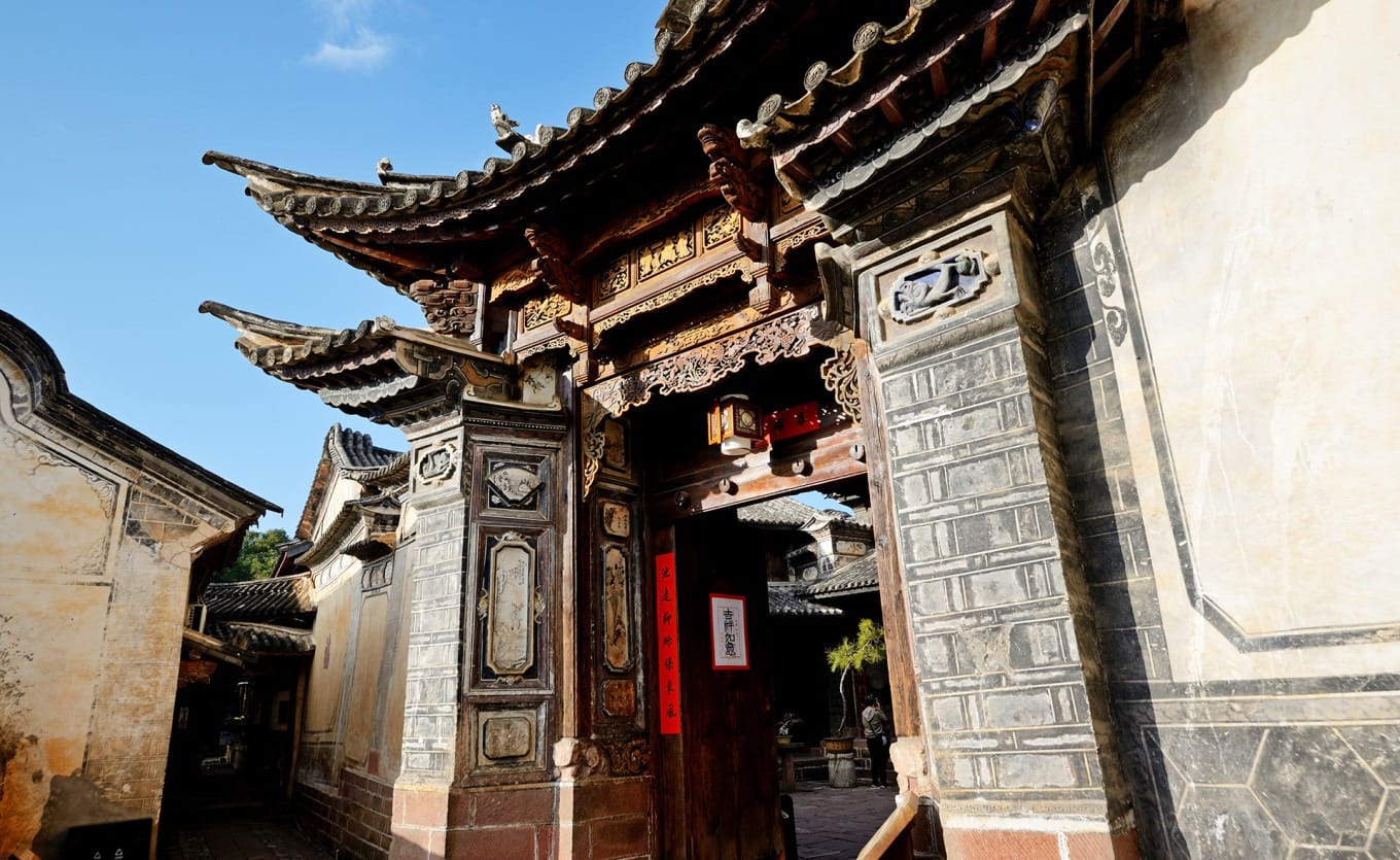 Intricate wood and brick carvings on the entrance gates of Ouyang Courtyard